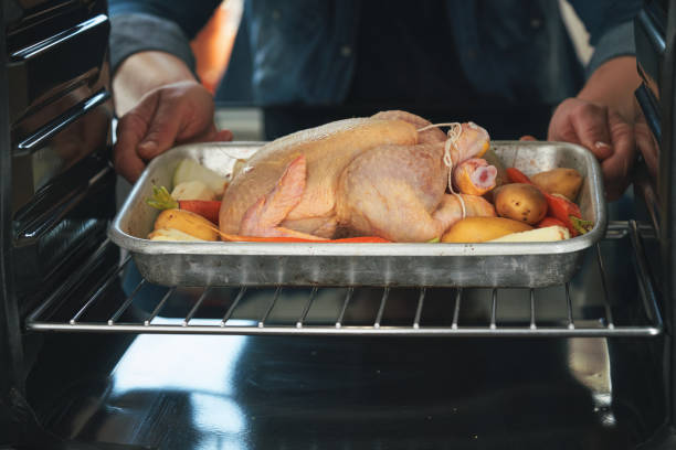 istock Roasting Chicken with Root Vegetables in the Oven 1830992467