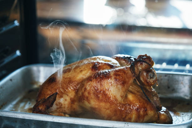 istock Roasting Chicken with Root Vegetables in the Oven 1830992487
