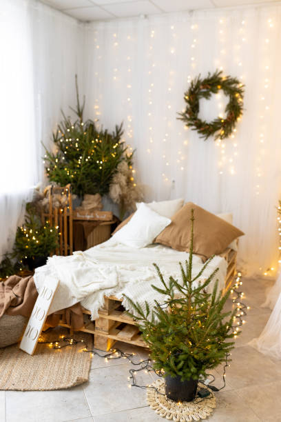 istock Silent Serenity: Capture tranquility of Christmas tree inquiet living room, with no people present. Emphasize peaceful ambiance created by soft glow of lights and gentle warmth of the room. 1831027989