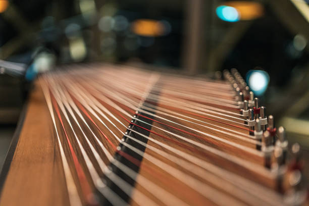 istock Close up of traditional zither white and red strings with blurred background 1831030705