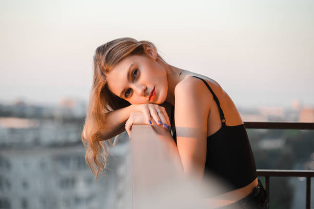 istock Woman in balcony 1831043149