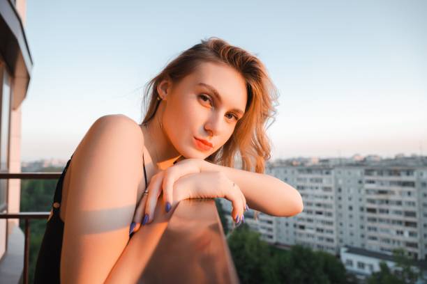 istock Woman in balcony 1831043152