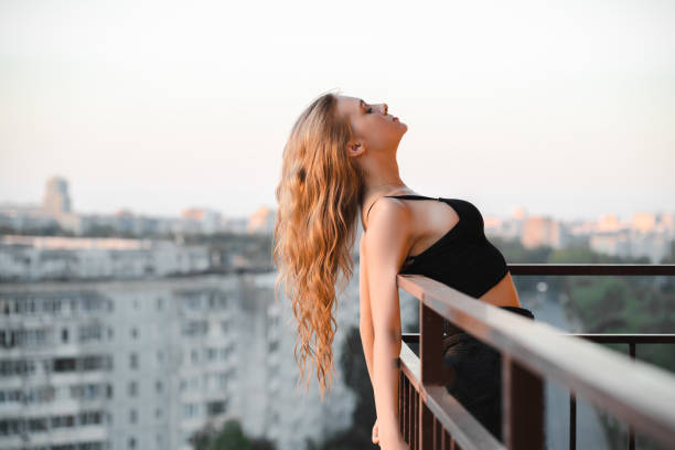 istock Woman in balcony 1831043667