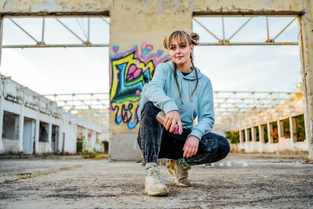 istock Female graffiti artist with spray can 1831054396