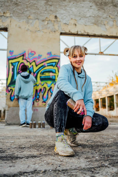 istock Female graffiti artist with spray can 1831056022