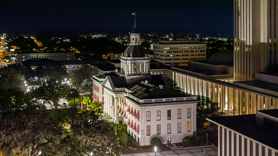 Florida State Capitol building with columned entrance rise above the night Tallahassee, FL cityscape. Photo denoise and enchanse