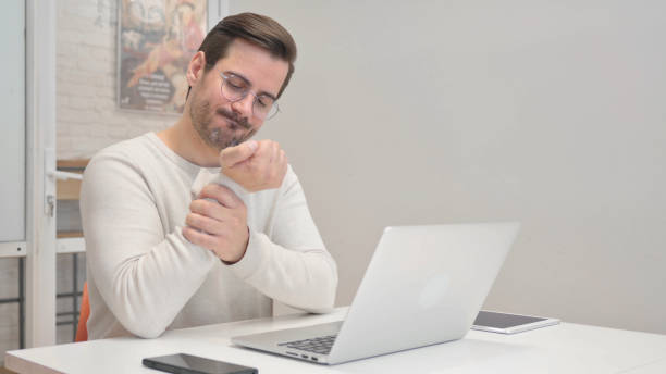 istock Middle Aged Man having Wrist Pain in Office 1831075584