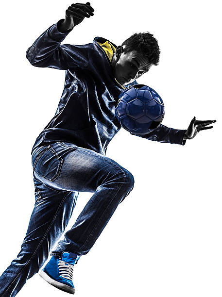 istock young man soccer freestyler player silhouette 183111259