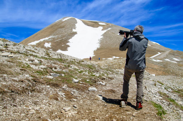 istock Photographer in the Sibillini Mountains 1831112735