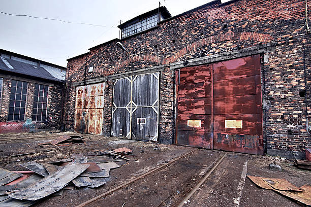 istock Industrial buildings covered in rust and patina 183114157