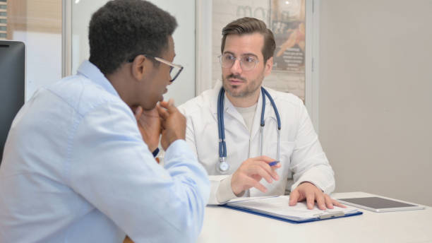 istock Man with Toothache Consulting Male Dentist 1831148449
