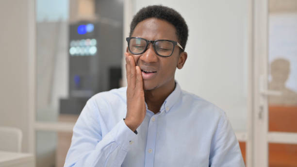 istock Uncomfortable African Businessman with Toothache in Office 1831186602