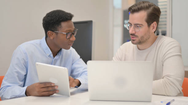 istock Business People Working on Tablet and Laptop in Office 1831193314