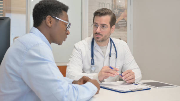 istock African Patient Discussing Health Issues with Doctor 1831193837