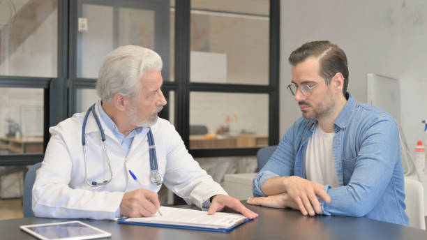 istock Patient Discussing Health Issues with Senior Doctor 1831202204