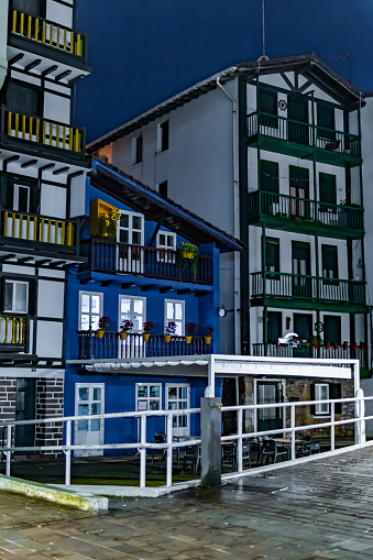 Colorful houses at dusk, with lights, rural village, ecotourism, travel, northern Spain, Hondarribia