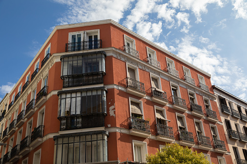 Corner building with balconies at Chueca's quarter in Madrid