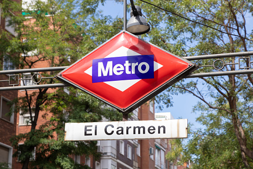 El Carmen metro station sign in the street of Madrid, Spain