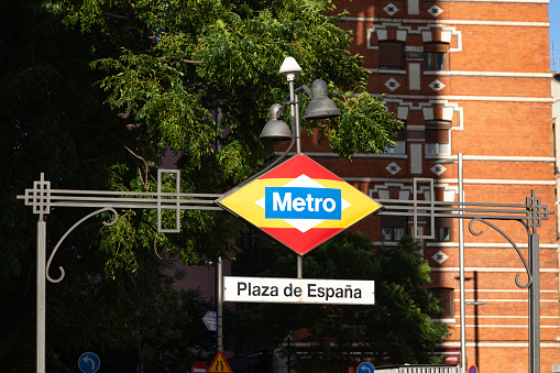 Plaza de España metro station sign in the street of Madrid, Spain