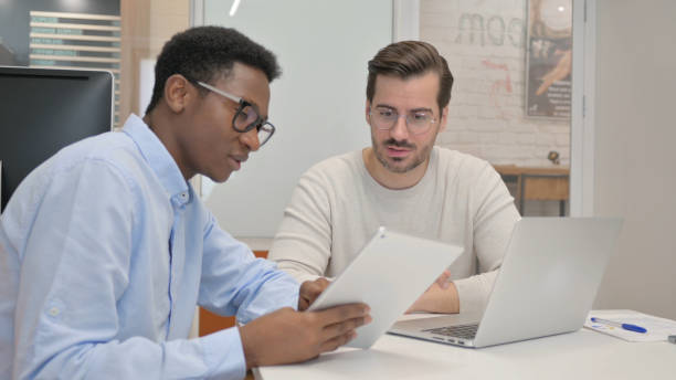 istock Business People Working on Laptop and Tablet in Office 1831266713
