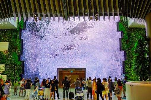 Singapore, Singapore - November 10, 2023: Changi Airport in Singapore, airport interiors, screen with waterfall
