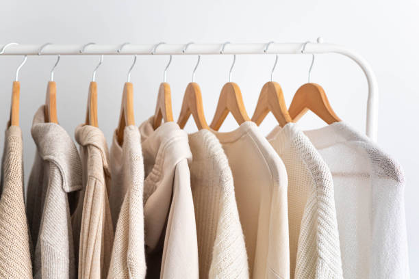 istock Hanger with neutral beige and white clothes on a white background. 1831278880