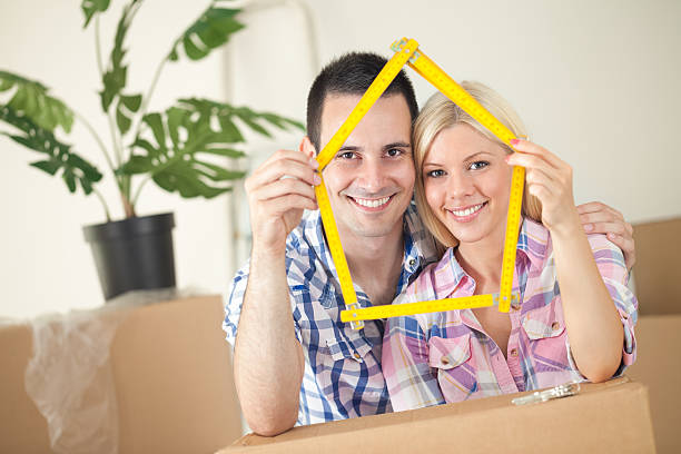 istock happy young couple moving in new home 183128985