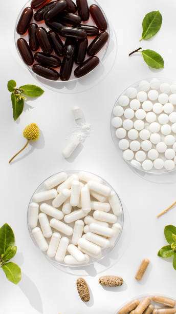 istock Various vitamins, tablets and dietary supplements with natural formulations on a white background. 1831328878