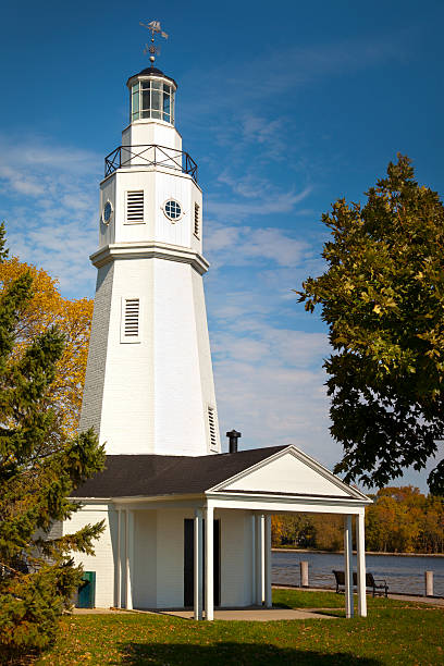 istock Quaint White Brick Lighthouse in Autumn 183136914