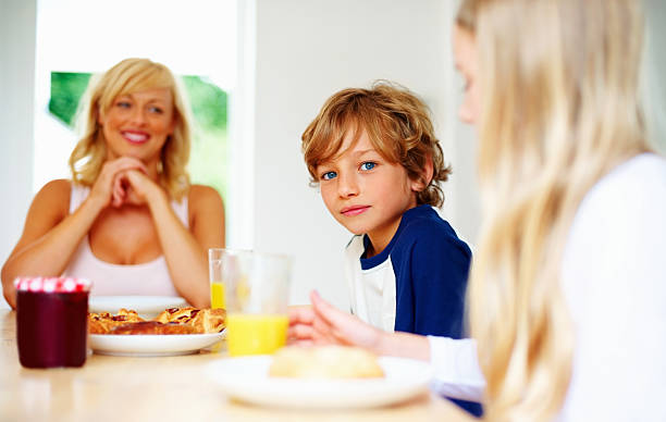 istock Young little boy with his family having breakfast together 183137161