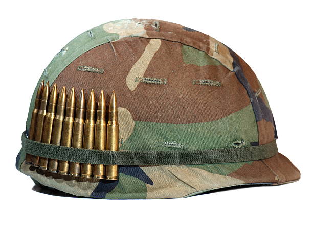 helmet a old helmet with bulletsPlease see some similar images from my portfolio: special forces vietnam stock pictures, royalty-free photos & images