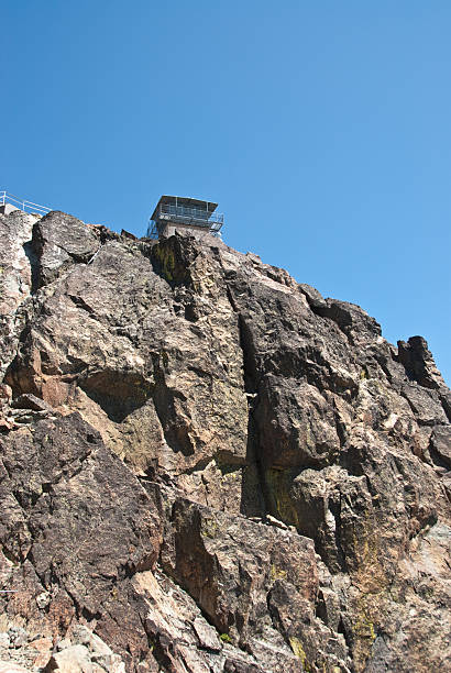 Historic Sierra Buttes Fire Lookout The Sierra Buttes Fire Lookout was built as a vantage point to spot fires around 1915, one of many in the Tahoe area. The 180 stairs to access the lookout were built in the summer of 1964 by five Tahoe men. This made it possible for people to visit the top safely. Sierra Buttes Fire Lookout is located in the Tahoe National Forest near Sierra City, California, USA. jeff goulden fire lookout stock pictures, royalty-free photos & images