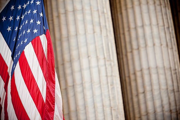 istock American flag and old white columns in Wall Street 183138716