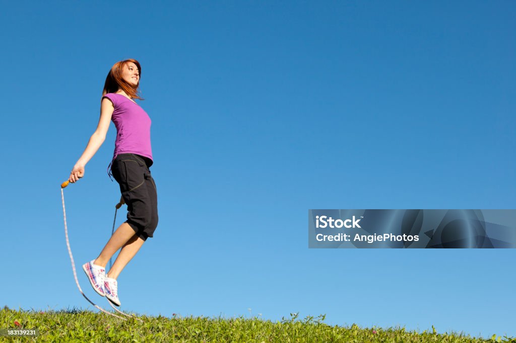 Young woman jumping rope 20-24 Years Stock Photo