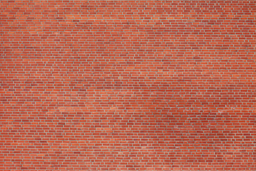Large red brick wall shot from a distance.