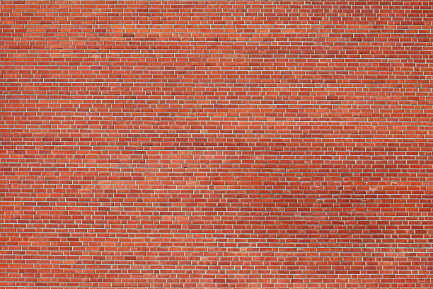 Large Brick Wall Large red brick wall shot from a distance. brick wall photos stock pictures, royalty-free photos & images