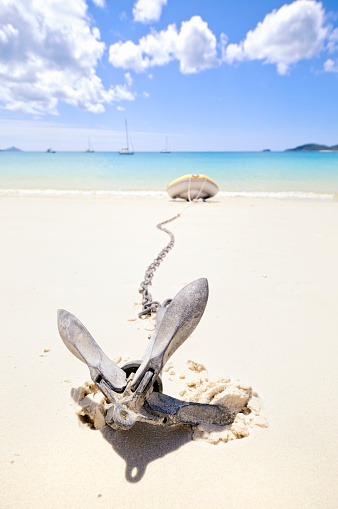 A dingy anchored on Whitehaven Beach in Queensland's Whitsunday islands, Australia.  Focus is on the anchor.