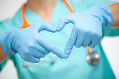 Doctor making heart shape with hands