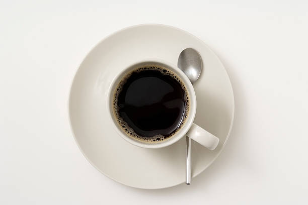 isolated shot of чашки кофе на белом фоне - coffee nobody macro directly above стоковые фото и изображения