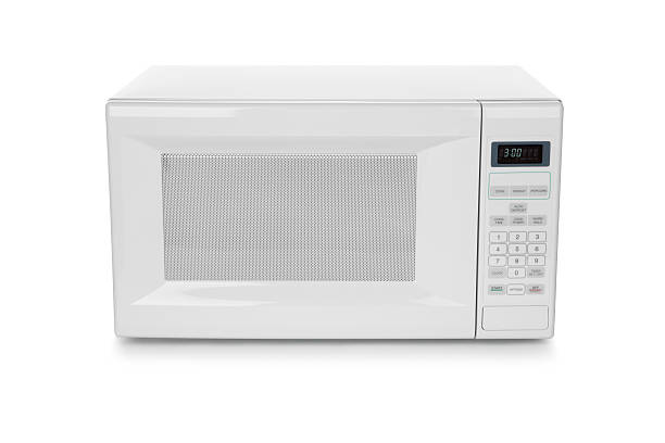 White microwave oven on white background stock photo