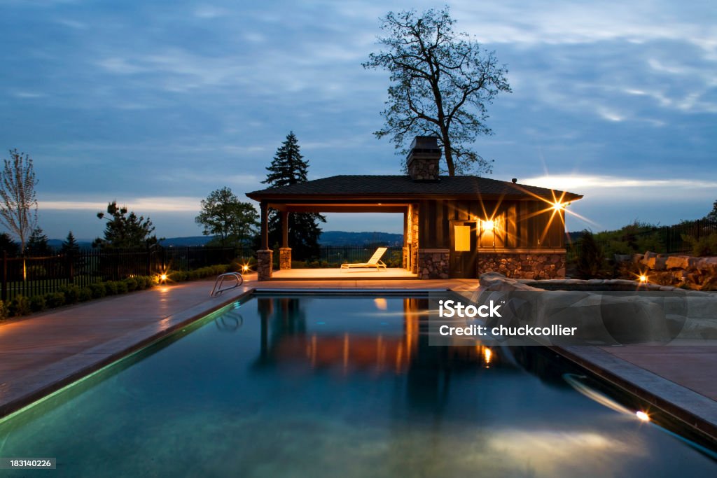 Swimming Pool at Dusk Swimming pool and pool house at dusk. Architecture Stock Photo