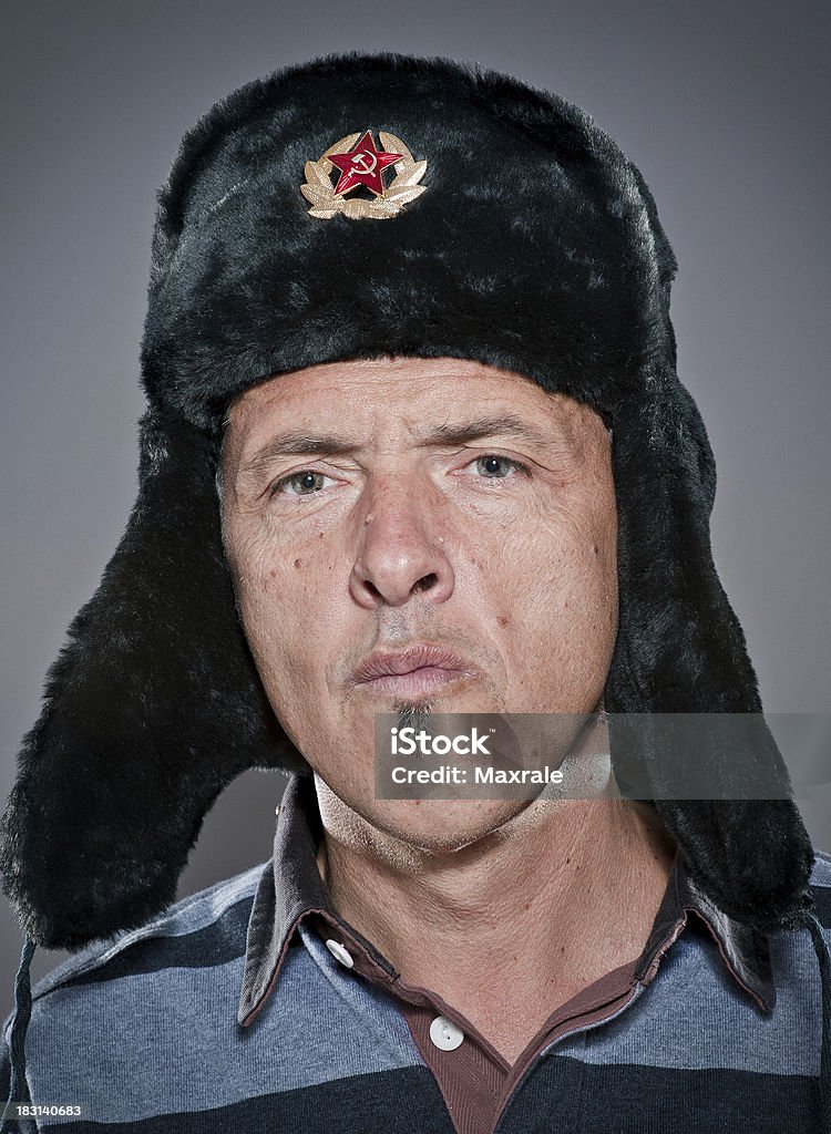 Russian man Russian man wearing a gray soviet furry hat with a strange face expressionNOTE FOR BUYERS: high sharpening Former Soviet Union Stock Photo