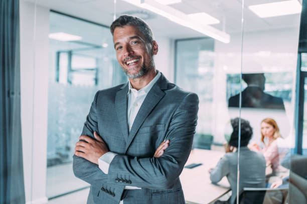 istock Confident businessman and his team. 1831418790