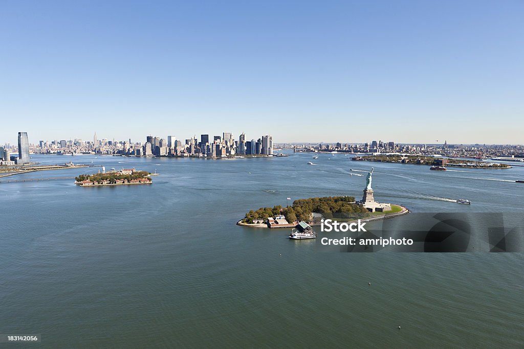 aerial view upper new york bay "flying over upper new york bay, facing statue of liberty, brooklyn, manhattan at clear sky" Aerial View Stock Photo