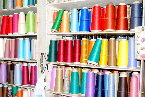 Colorful threads on the shelves.