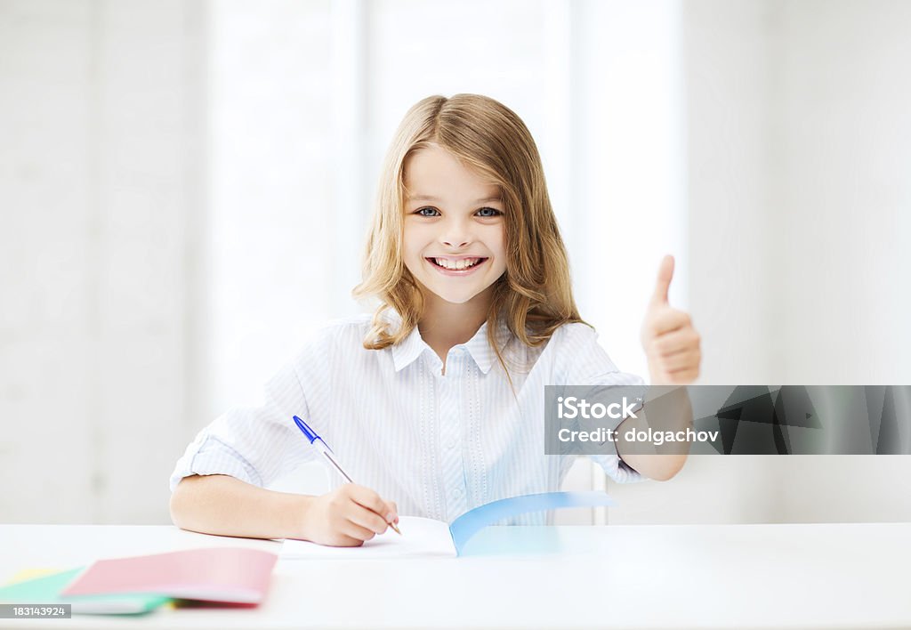 student girl studying at school education and school concept - smiling student girl studying at school Adult Student Stock Photo