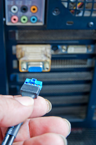 istock Close up of  technician's hands wiring computer parts 183144158