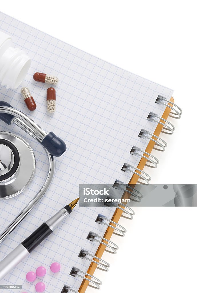 stethoscope with pills and notebook medical stethoscope with pills and notebook isolated on white background Capsule - Medicine Stock Photo