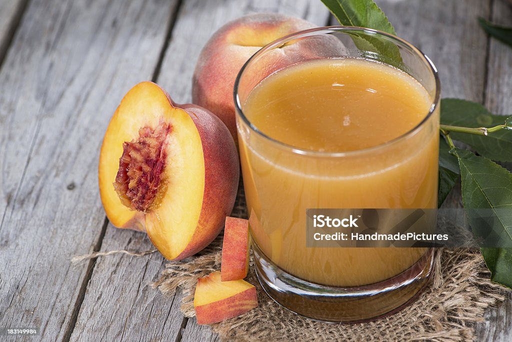 Fresh made Peach Juice Fresh made Peach Juice on vintage wooden background Apricot Stock Photo