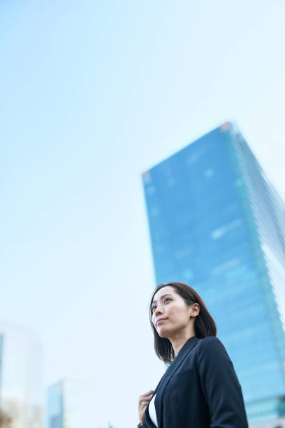 istock Business woman looking up at the sky 1831516152